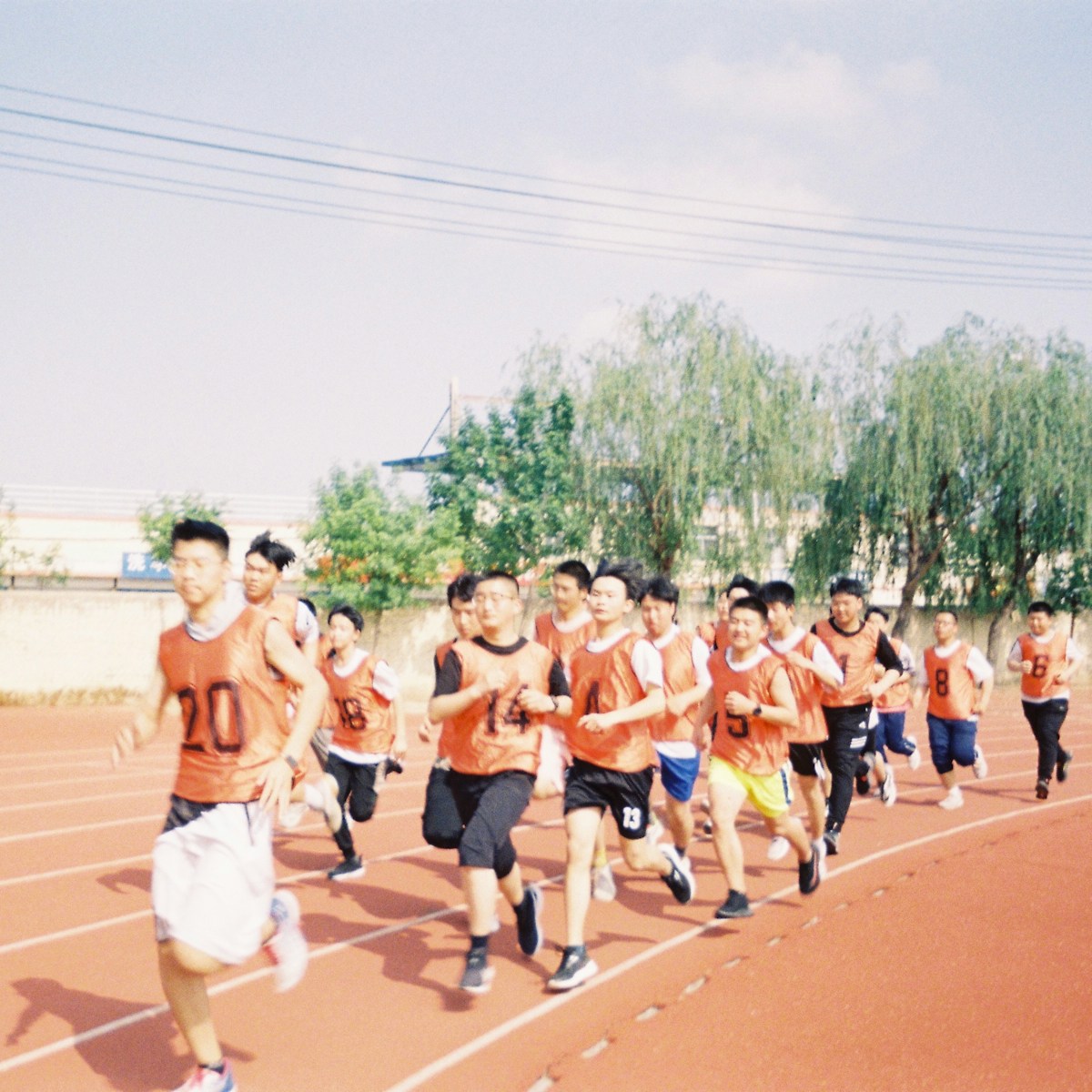 Home 21 personalised t shirt print a group of young men running on a track